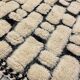 Large cream and black checked Berber rug, 280 × 200 cm.