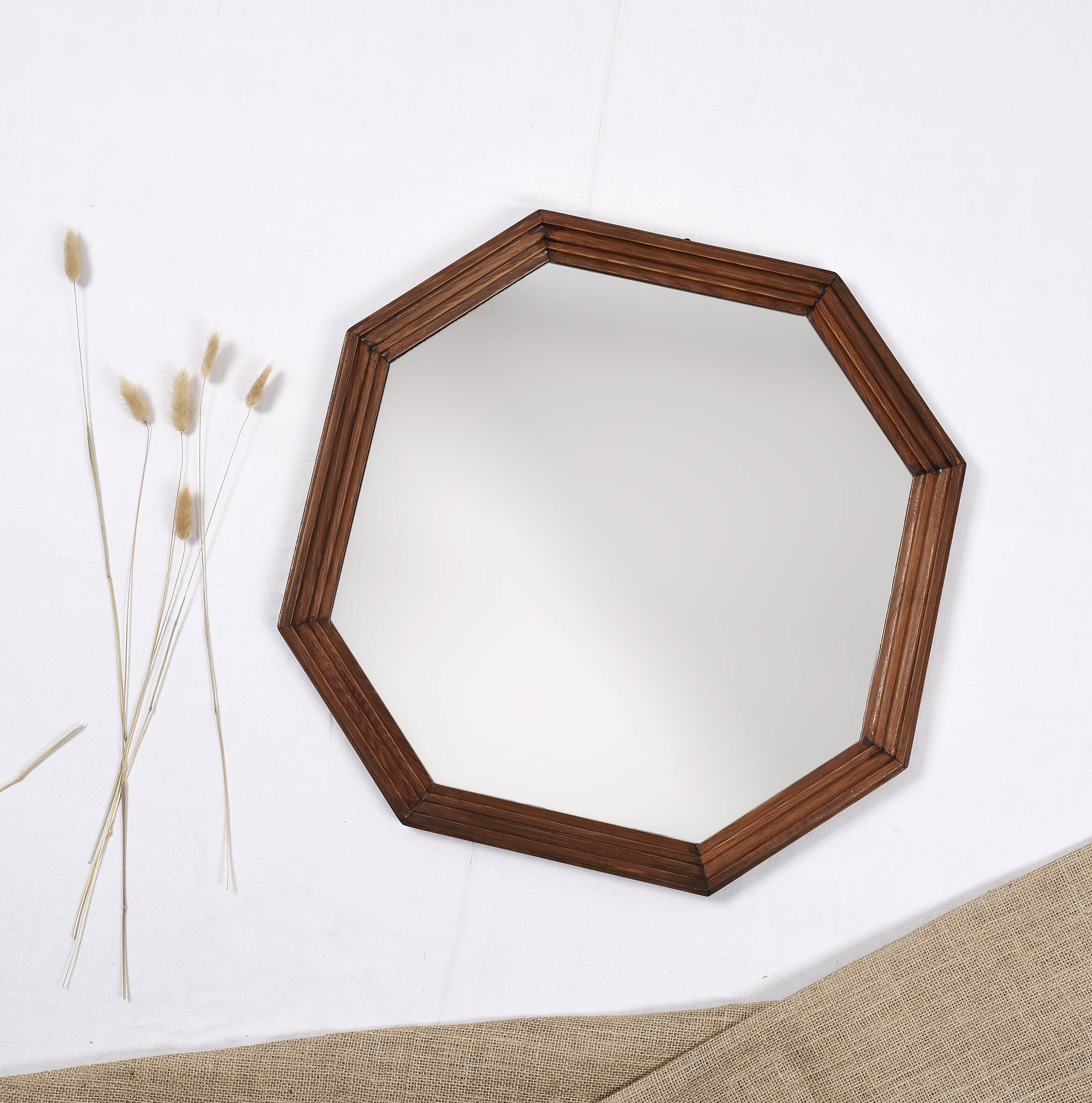 Old second-hand wooden mirror, octagonal shape.
