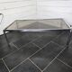 Chromed metal coffee table with smoked glass top from the 70s
