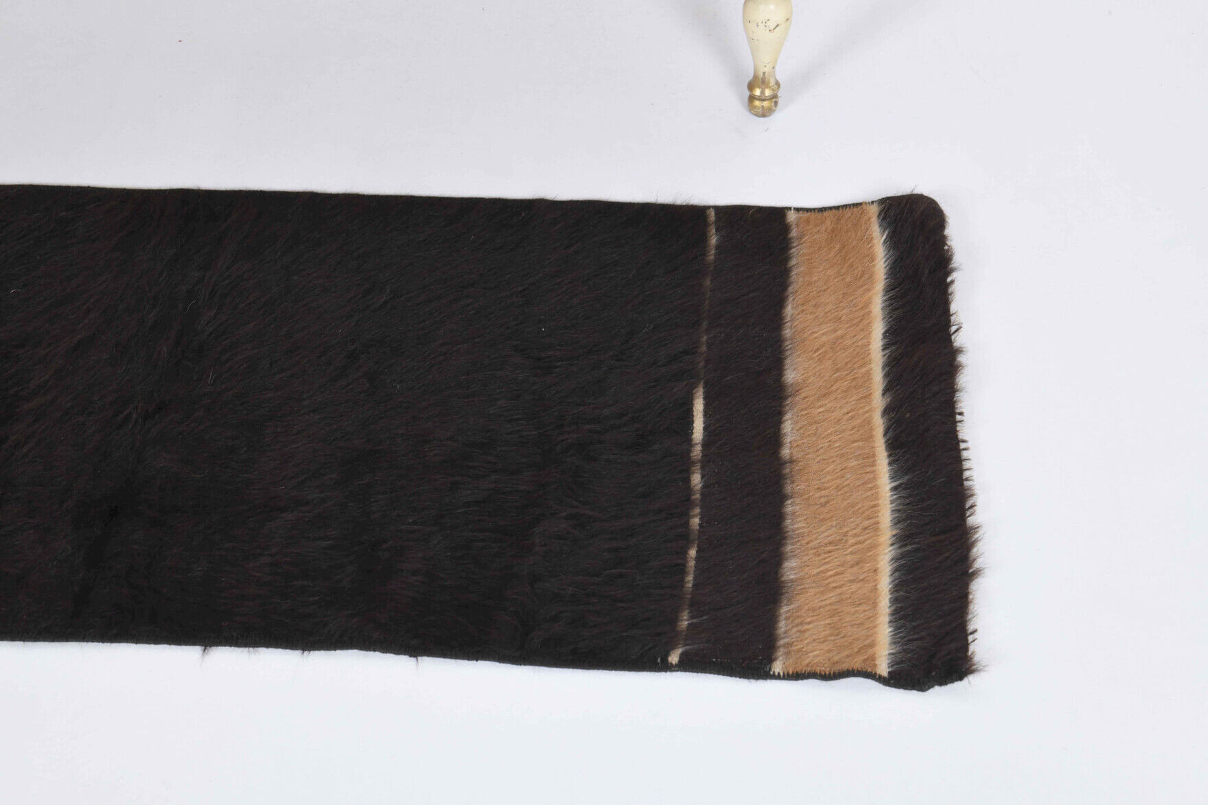 Small vintage flat-woven black rug.