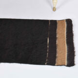 Small vintage flat-woven black rug.