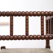 Antique Dutch oak corner chair with turned spindles and new rush seat