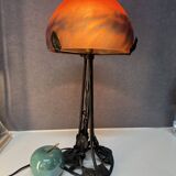 Contemporary mushroom lamp, wrought iron base and orange glass shell with blue hues in the art deco style