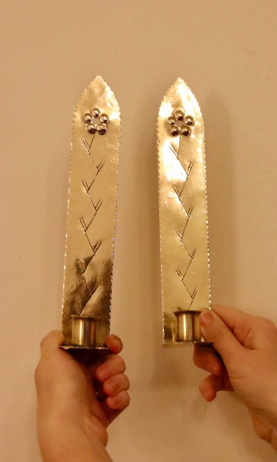 A pair of Swedish brass wall sconces from the mid-century.