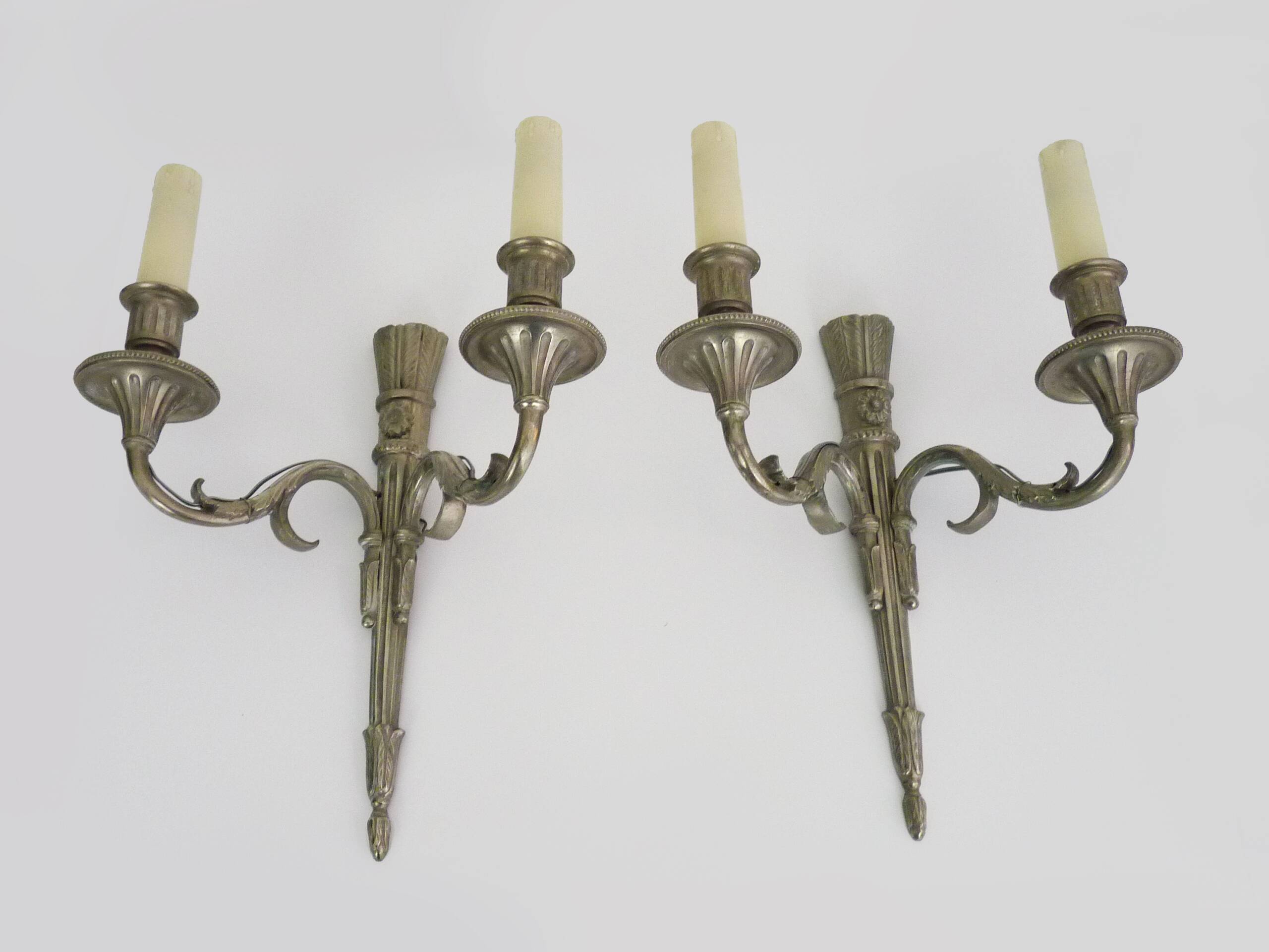 Pair of empire style double light wall lights in silvered bronze. the 50's