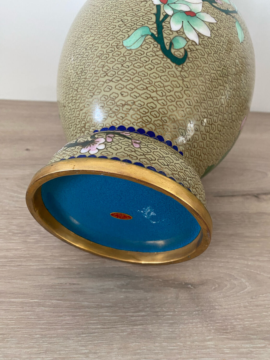 Chinese cloisonné vase decorated with flowers and butterflies.