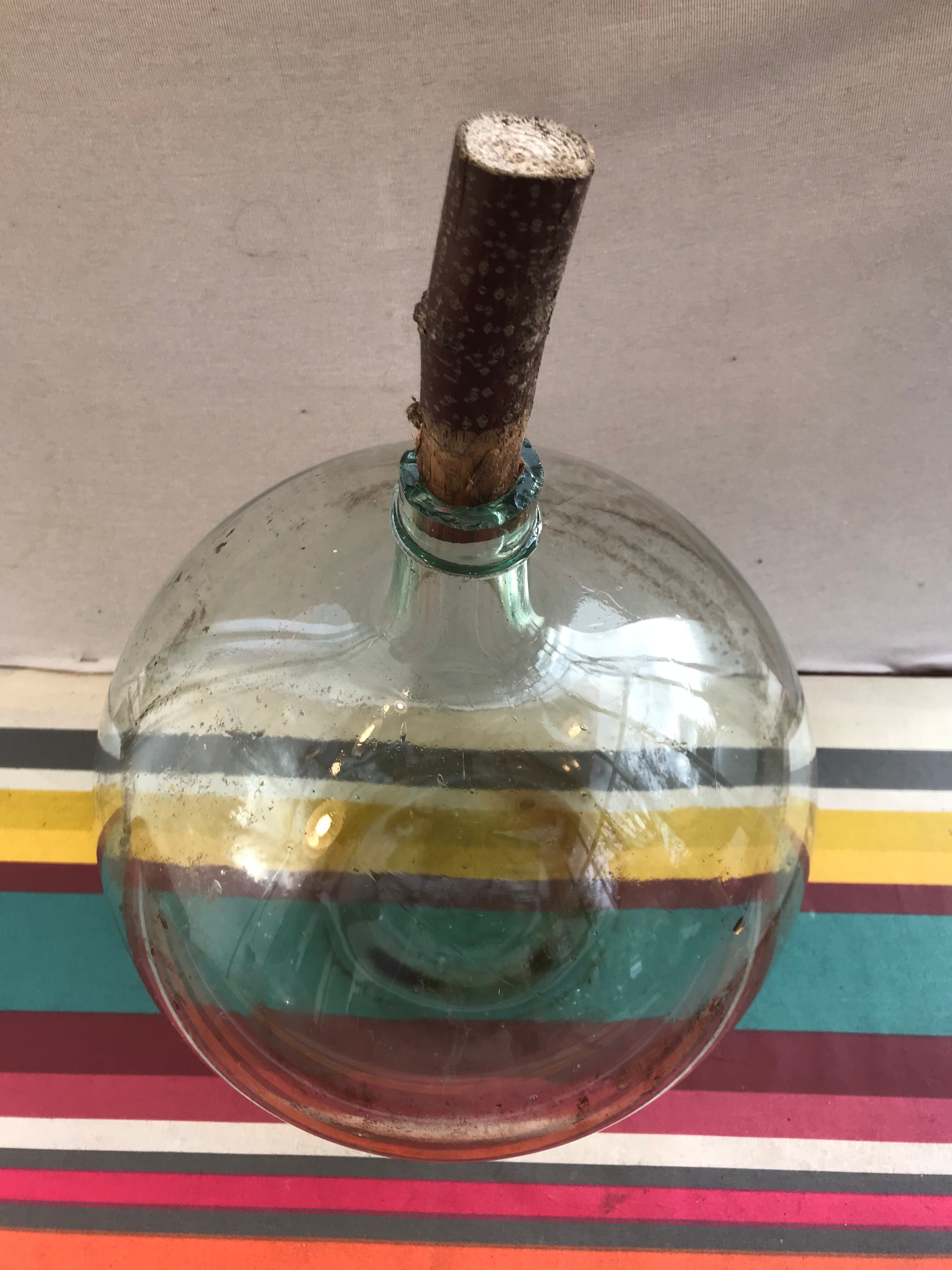Former green glass demijohn