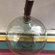 Former green glass demijohn