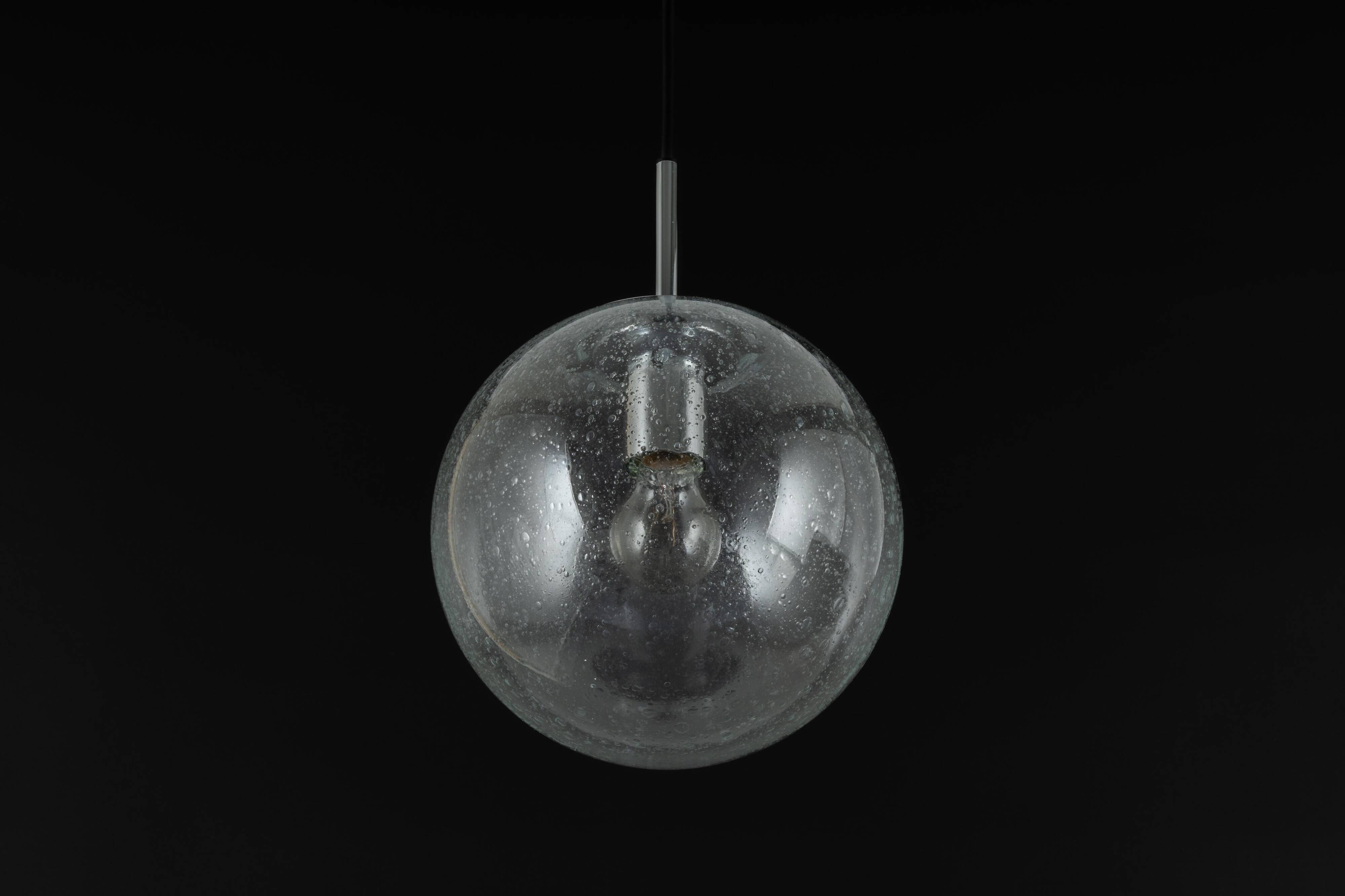 Small Limburg chrome pendant light with clear glass globe, Germany, 1970s.