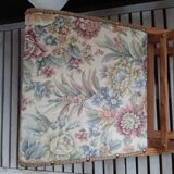 Wooden footrest and vintage tapestry