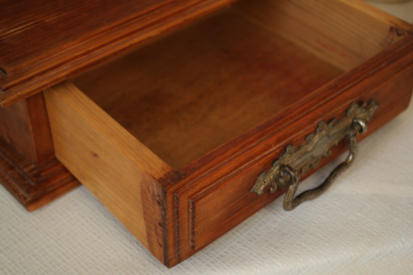 Antique wooden table mirror in Art Deco style.