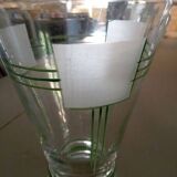 Carafe of green-striped liquor and its three glasses