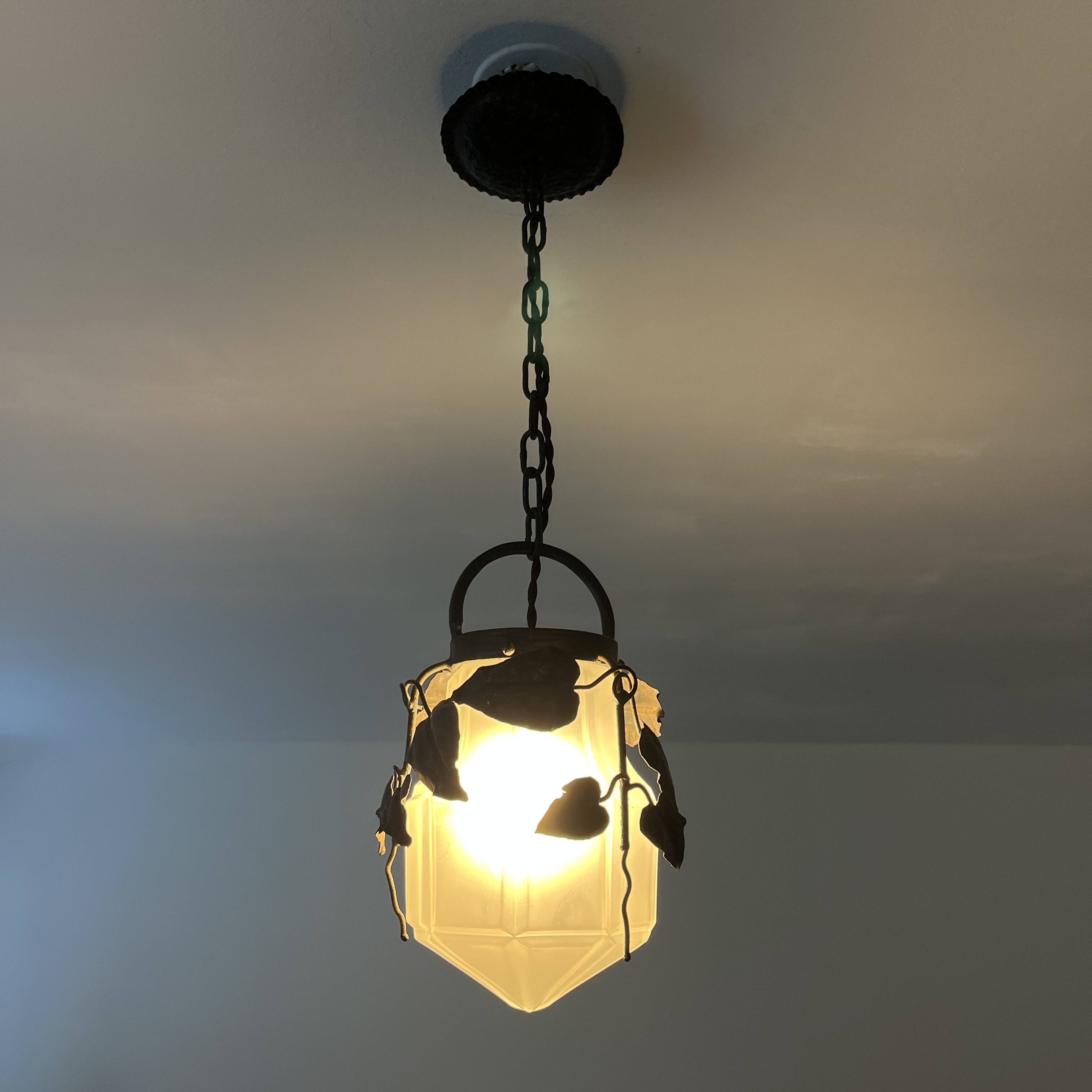 Antique glass and wrought iron pendant light with ivy decor Art Deco chandelier globe