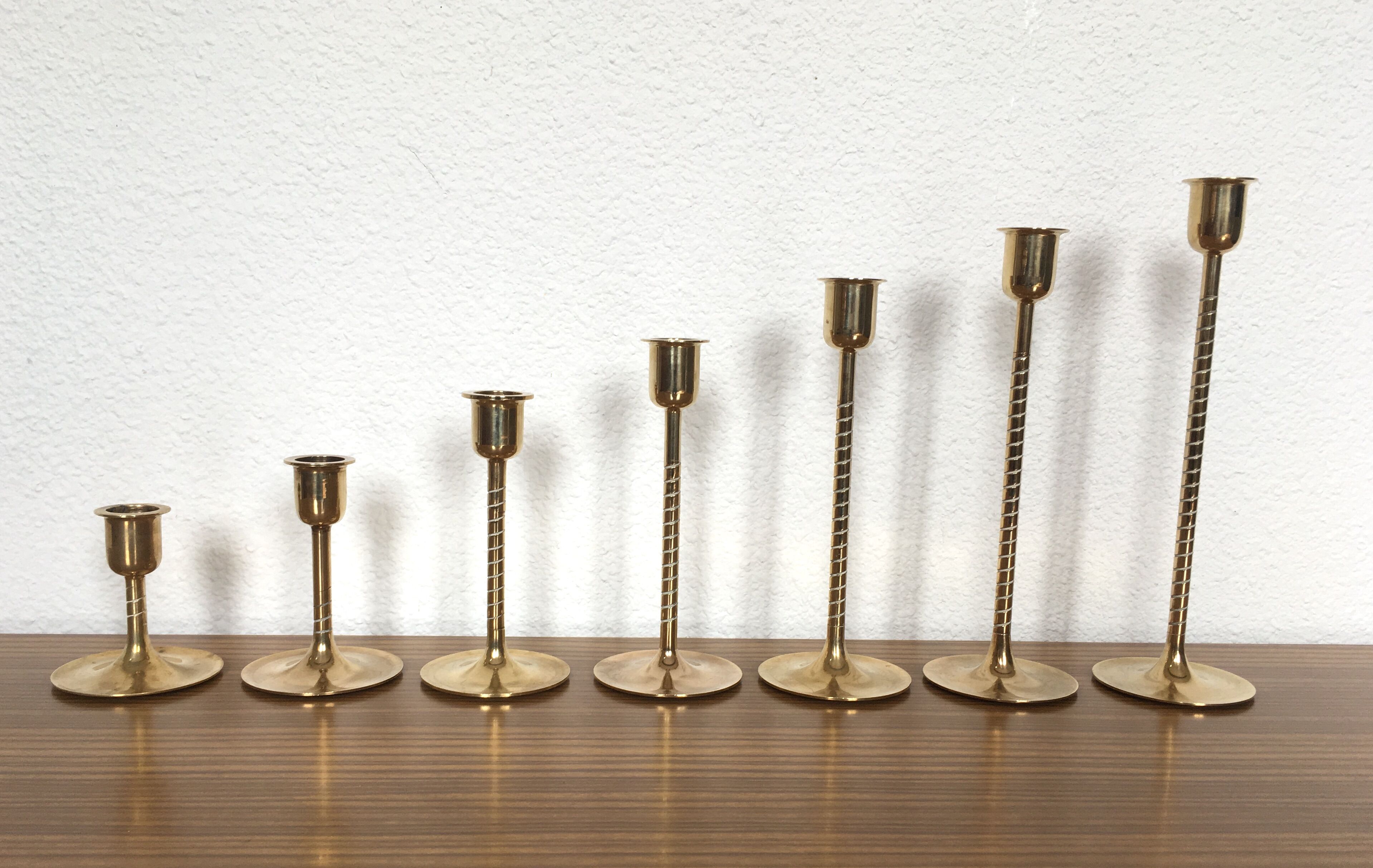 Series of 7 Scandinavian brass candlesticks