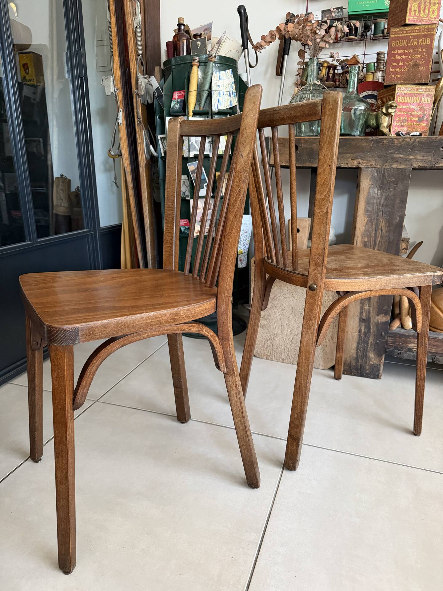 Pair of vintage Baumann bistro chairs in wood.