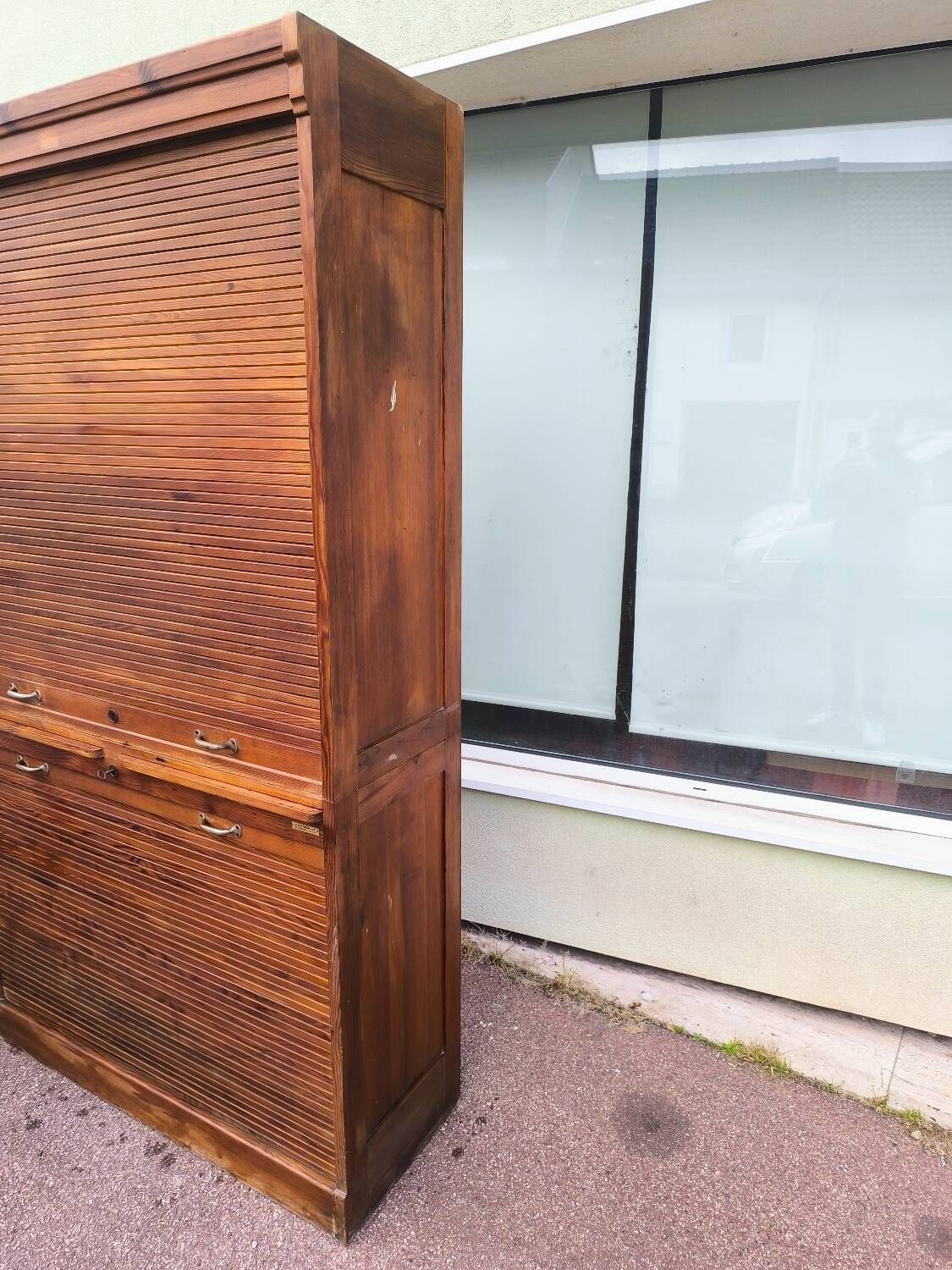 Vintage 1940s secretary desk with wooden curtains, storage, and shutters.