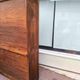 Vintage 1940s secretary desk with wooden curtains, storage, and shutters.