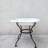 Antique bidet in enamelled sheet metal with wrought iron support