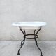 Antique bidet in enamelled sheet metal with wrought iron support