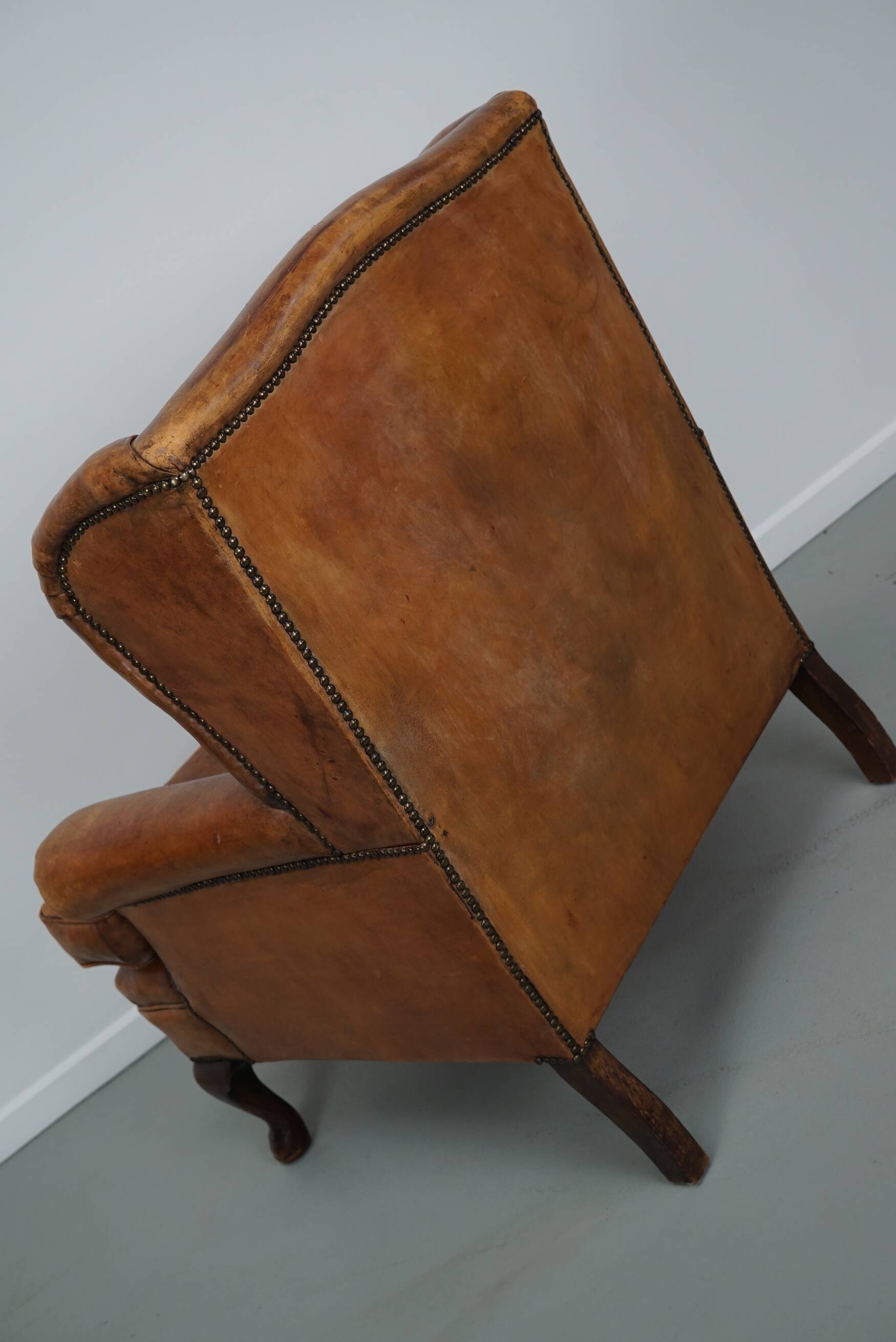 Vintage Dutch cognac coloured leather club chair, with footstool