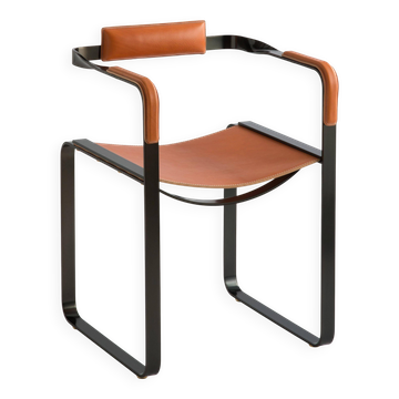 Armchair, smoked black steel and natural tobacco saddle leather Contemporary design