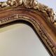 Miroir Louis-Philippe en bois et stuc doré à décor floral, XIXe,  43x38 cm