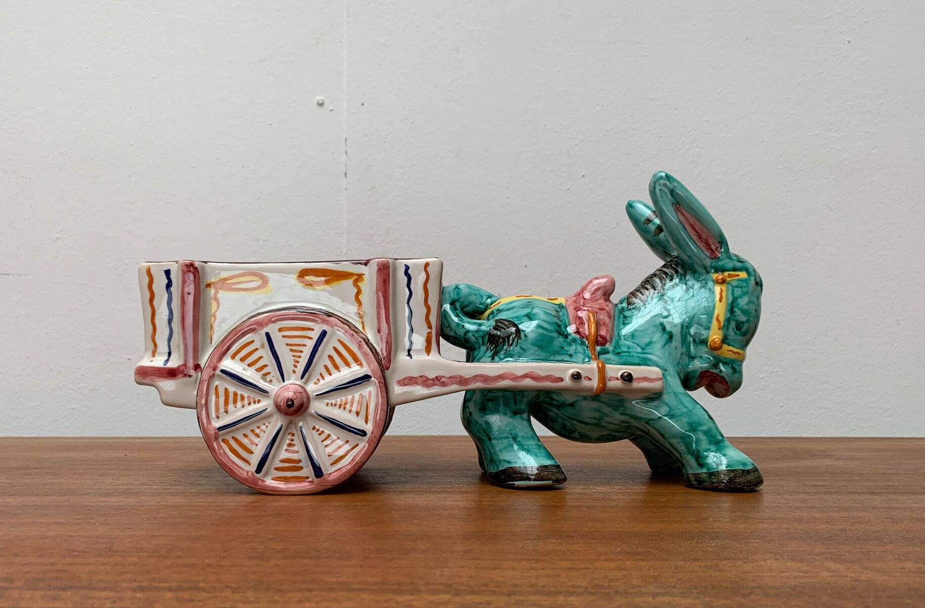 Vintage Italian hand-painted sculpture of a donkey with a cart in the shape of a bowl from Deruta, Italy.
