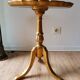 Golden wood tripod pedestal table