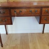 English wooden desk on top of leather