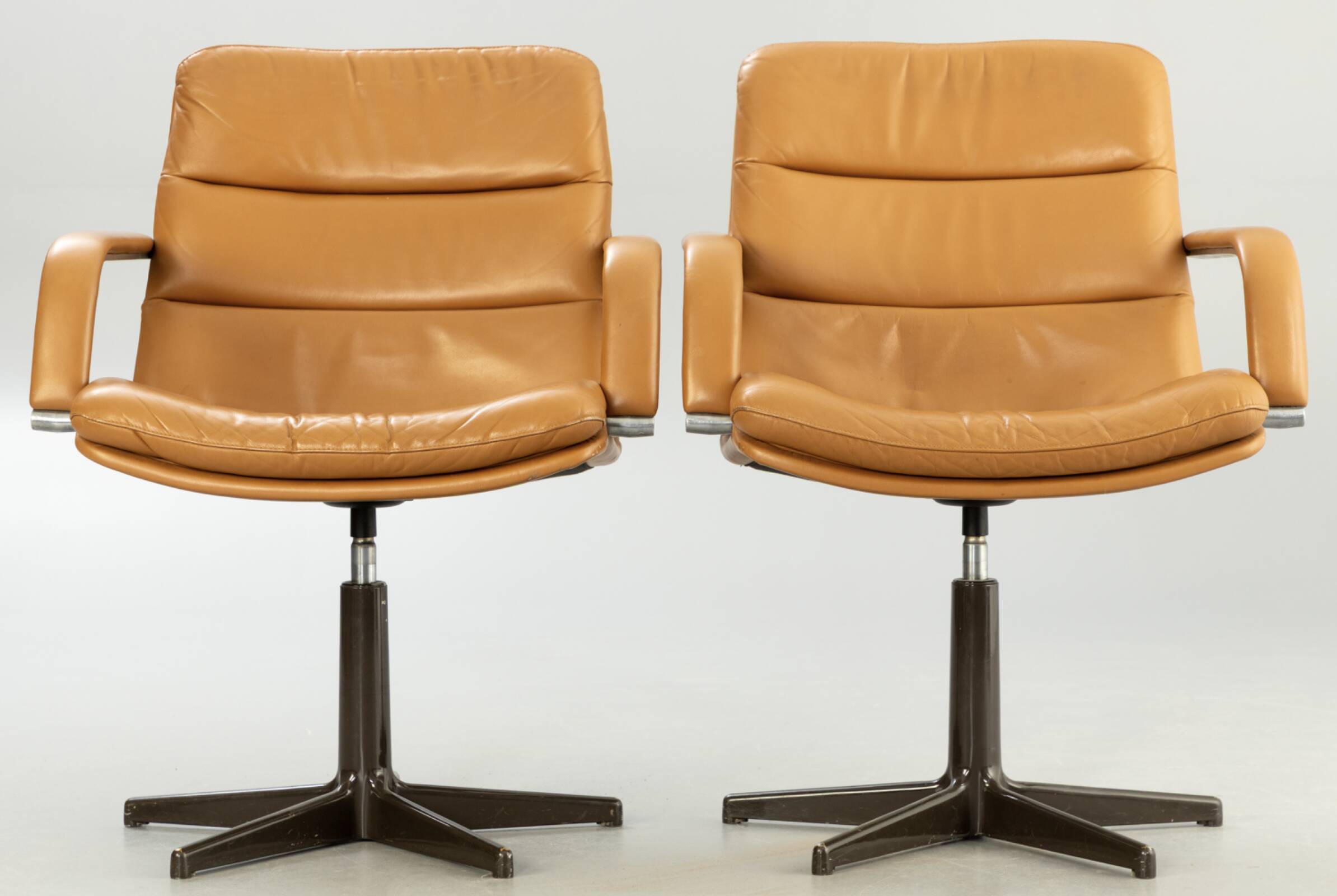 Pair of swivel armchairs by Geoffrey Harcourt.