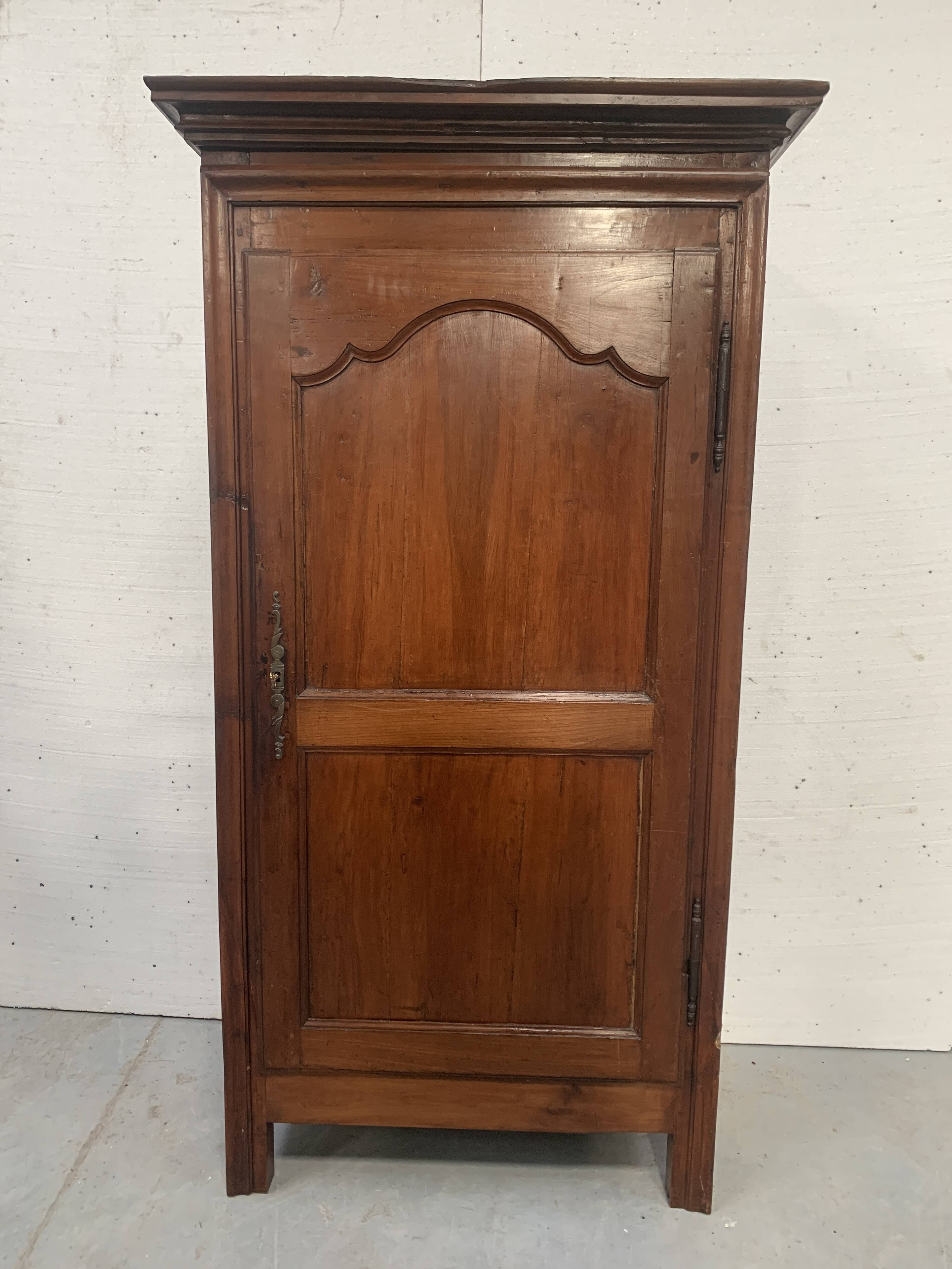 Louis Philippe style bonnetière in solid cherry wood, 19th century