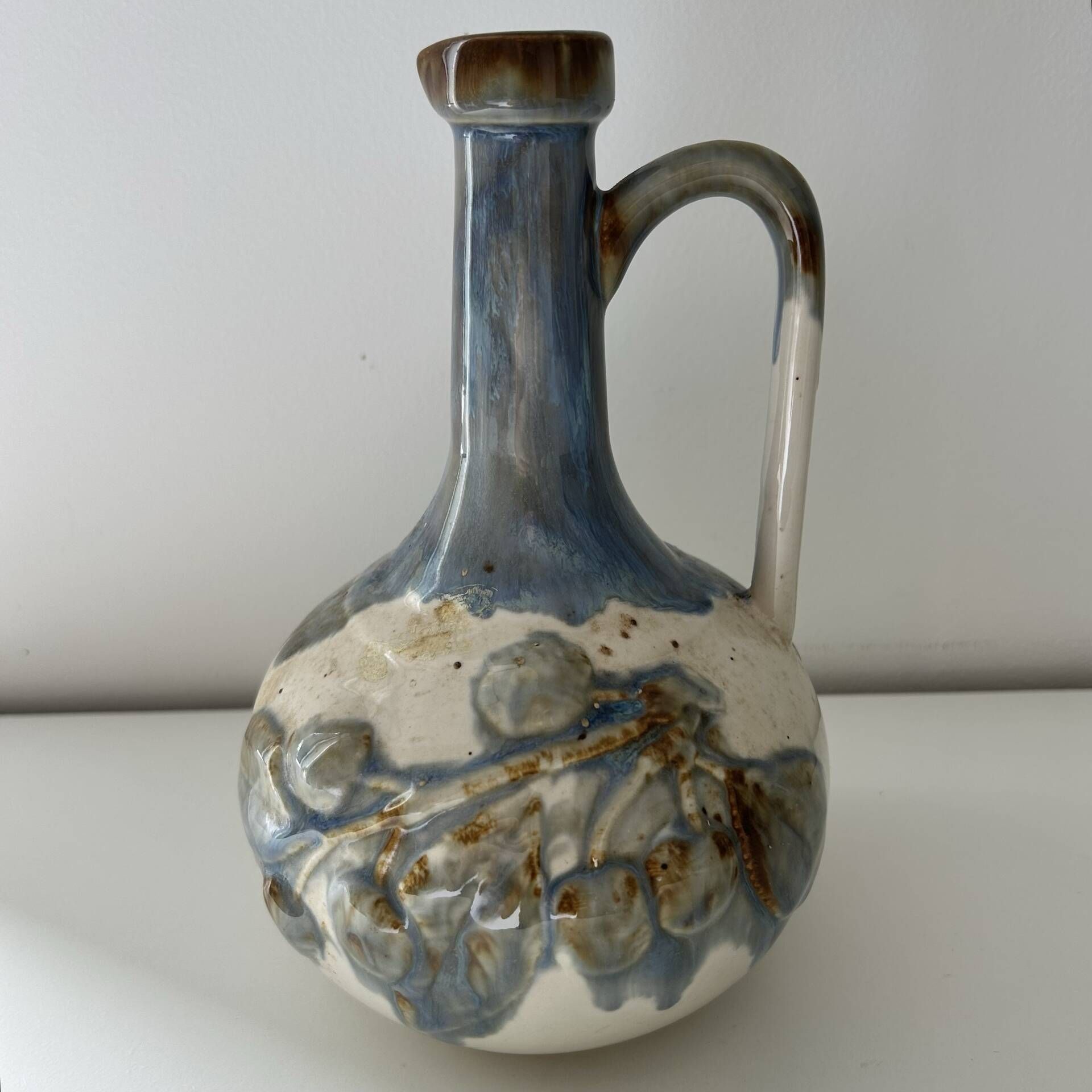 Cherry-decorated earthenware carafe