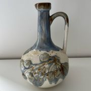 Cherry-decorated earthenware carafe