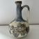 Cherry-decorated earthenware carafe