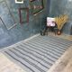 Handwoven vintage geometrical rug, grey background