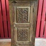India. Bonnetière with a teak door finely carved by hand.