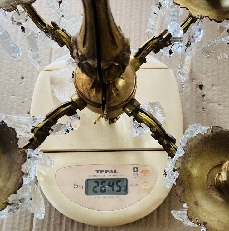 Pair of gilt bronze wall sconces with pendants from the mid-20th century.