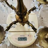 Pair of gilt bronze wall sconces with pendants from the mid-20th century.