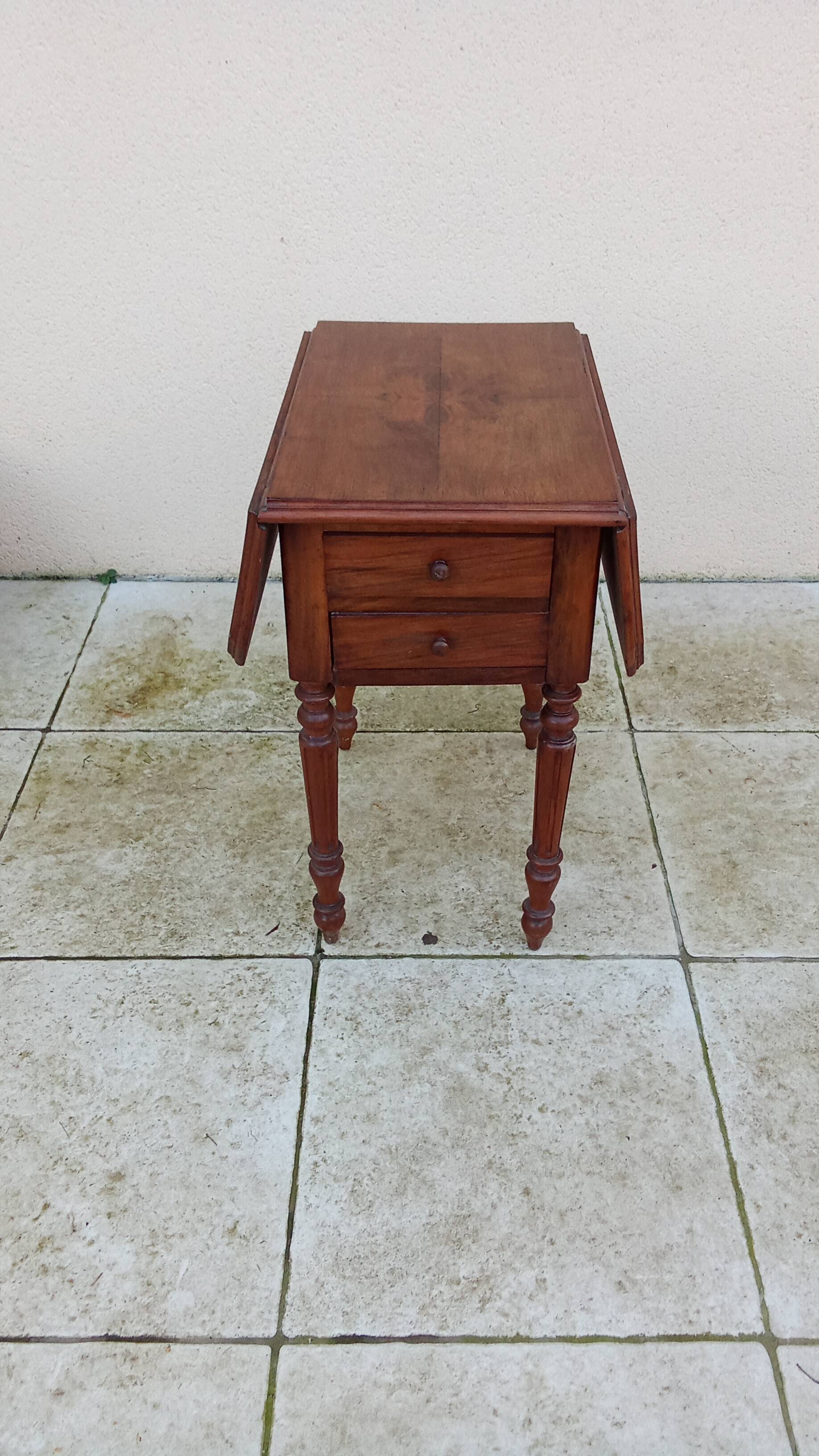 Antique small drop-leaf table from the 19th century.