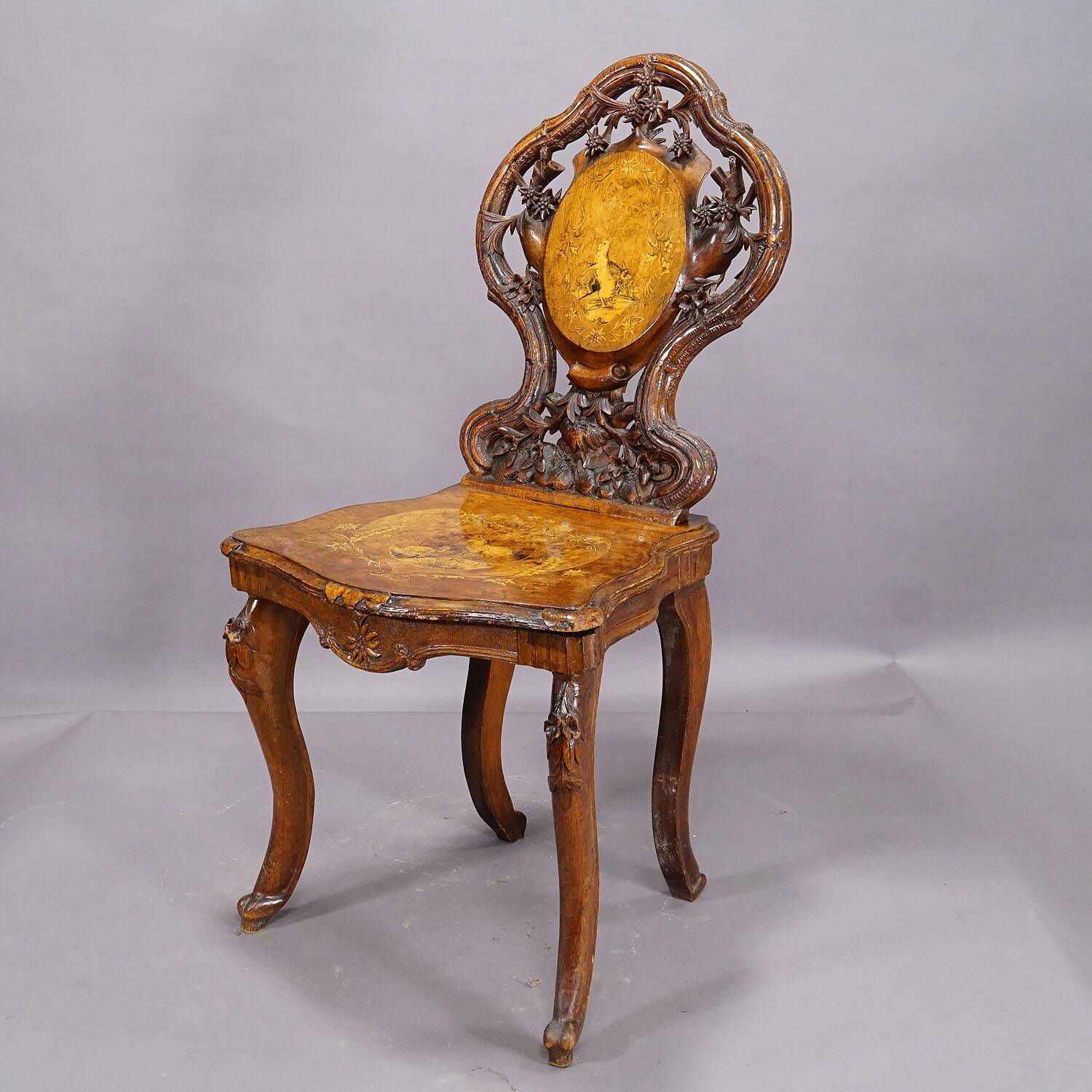 Pair of walnut chairs with Edelweiss marquetry, Brienz Switzerland 1900