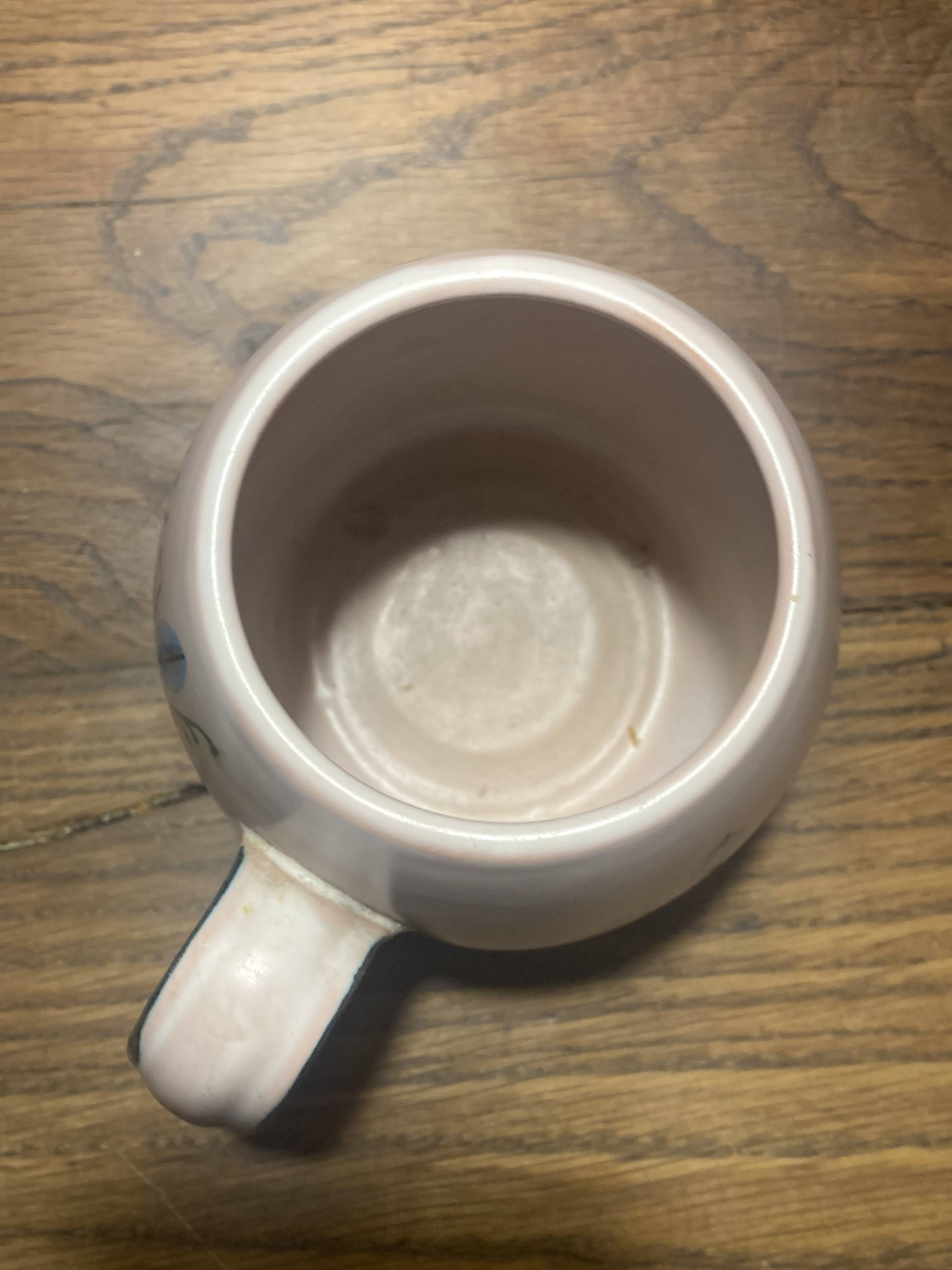 Set of two ceramic mugs signed Yvon ROY