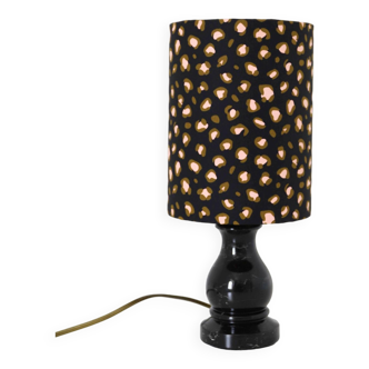 Small old lamp with black lacquered wooden base and leopard print lampshade