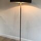 Floor lamp in black lacquered metal and brass