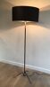 Floor lamp in black lacquered metal and brass