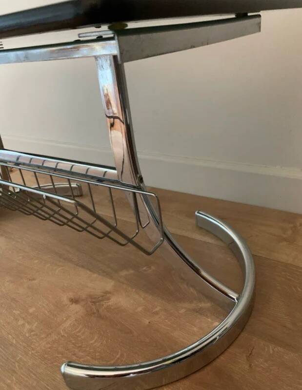 Space Age coffee table in chrome metal and smoked glass with magazine rack – Circa 1970