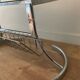 Space Age coffee table in chrome metal and smoked glass with magazine rack – Circa 1970