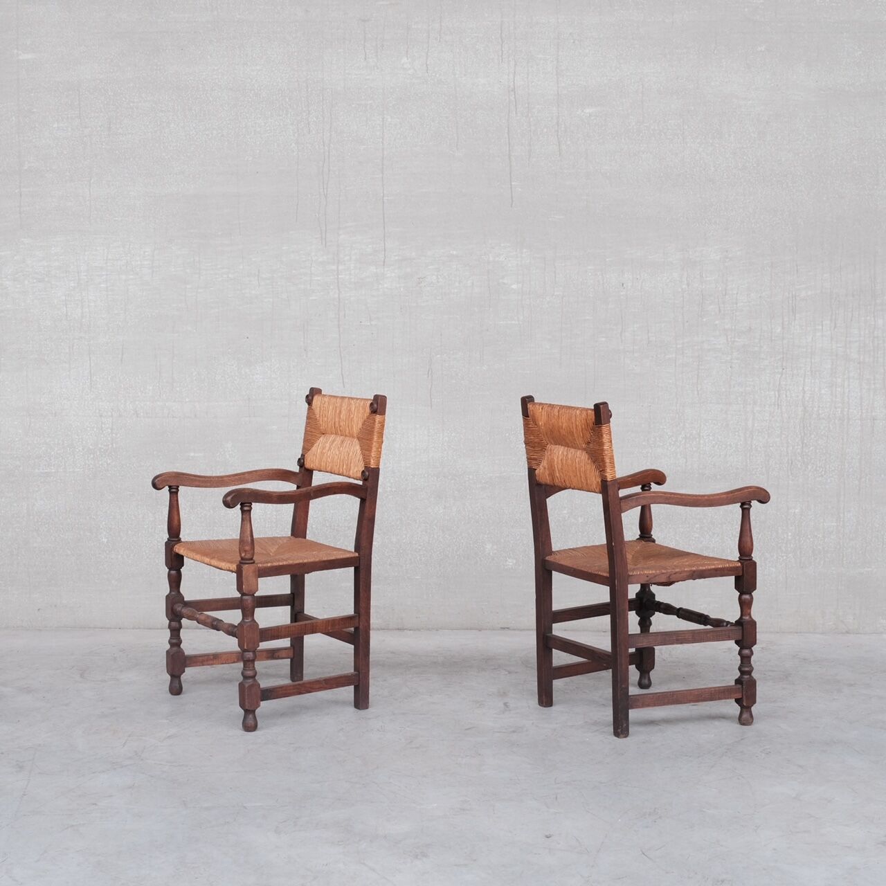 Pair of mid-century oak and rush french armchairs