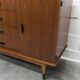 1960s teak sideboard with 4 drawers, 2 doors, and a mirror.