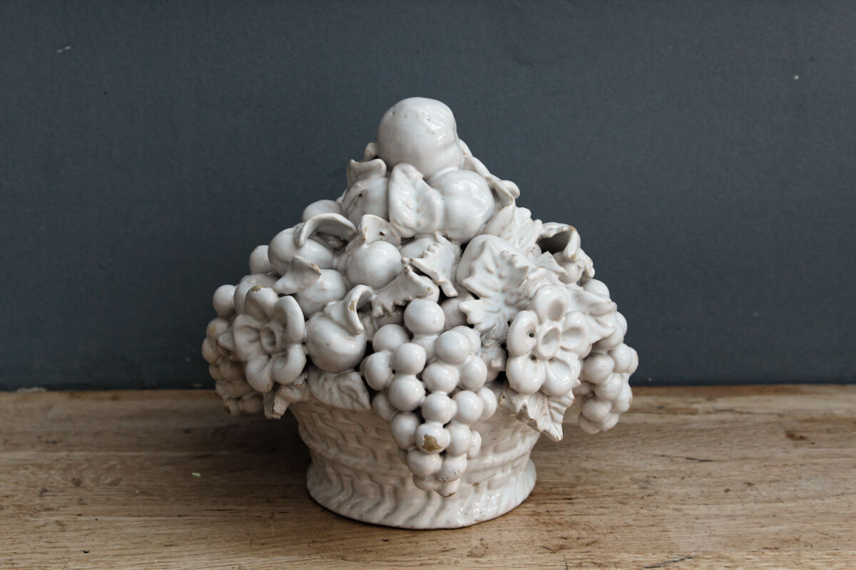 Ornamental basket decorated with trompe l'oeil fruits