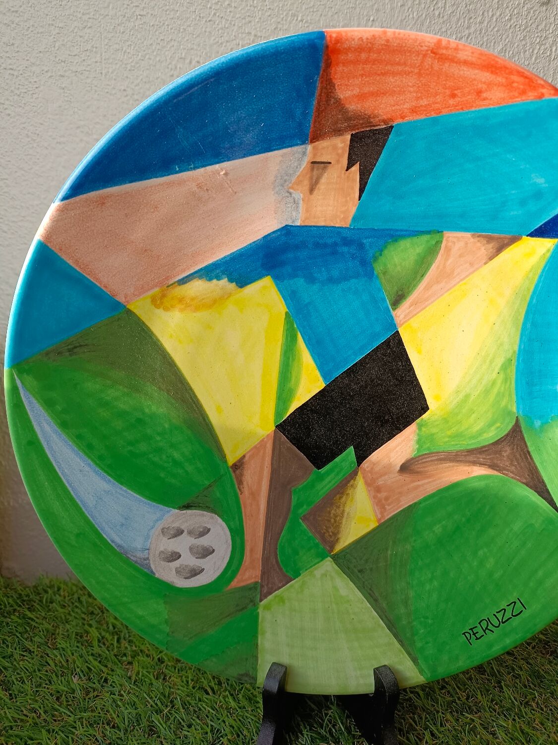 Osvaldo Perruzzi designer of polychrome faience plates.